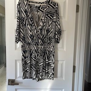 Black & White shorts romper with draw string at the waist.